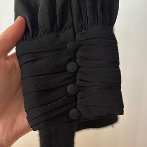 Black Buttoned Sleeve Detail